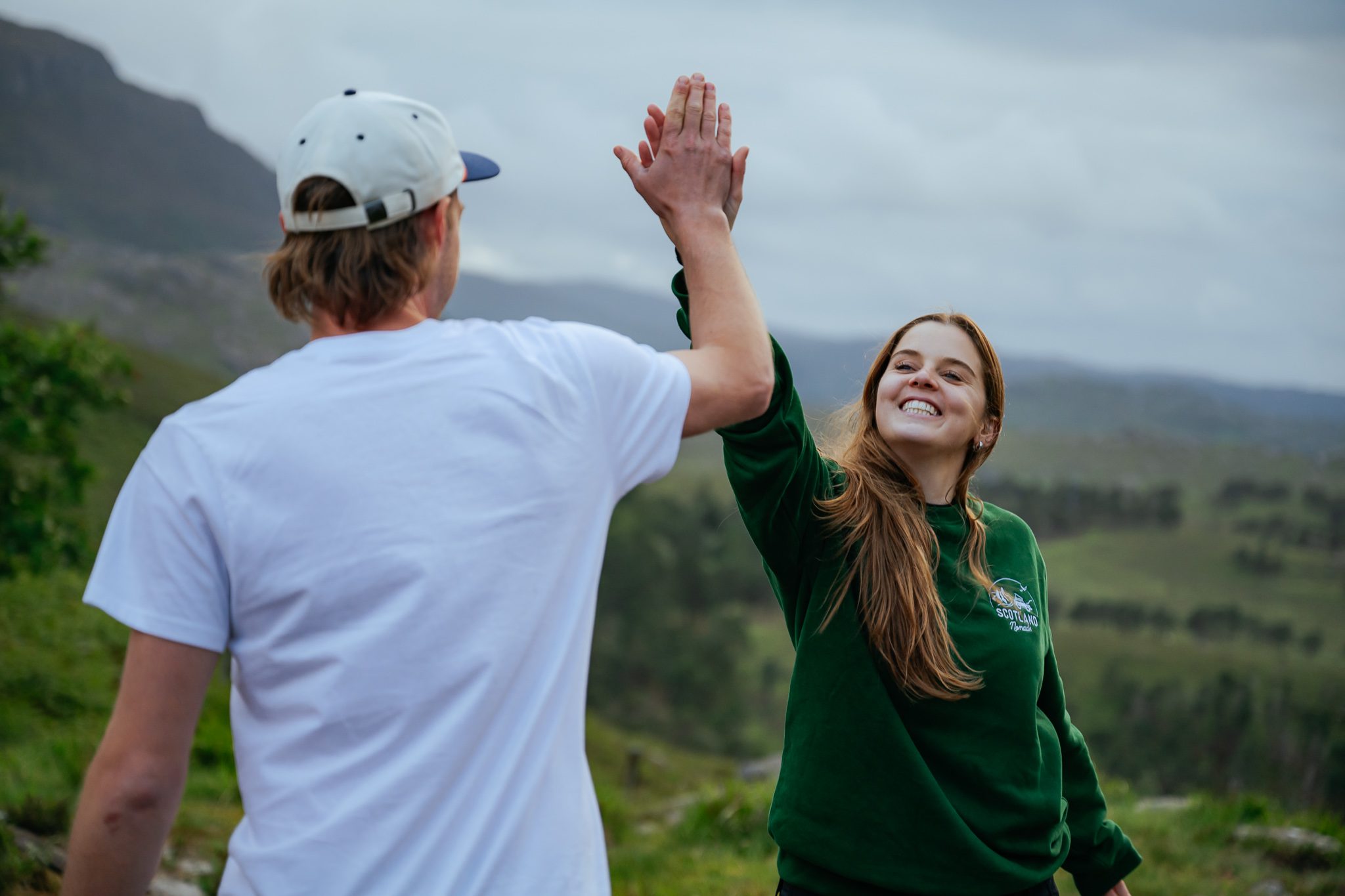 Happy high five Scotland roadtrip SUV Isle of Skye