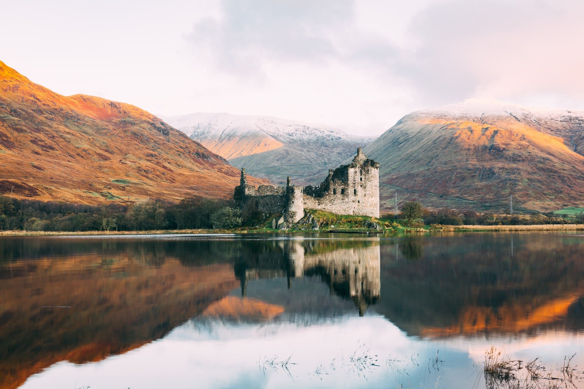 kilchurn castle ruins reflected in loch awe scotland